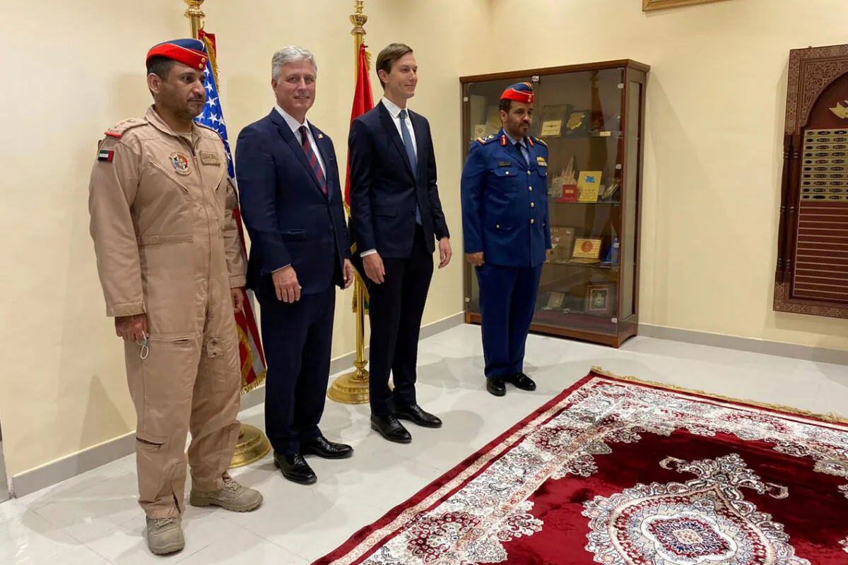 U.S. President Senior Adviser Jared Kushner and U.S. national security adviser Robert O'Brien pose for a group photo with UAE's Air Force Major General Falah Al Qahtani, at Al Dhafra airbase in Abu Dhabi, United Arab Emirates on Sept. 1, 2020. (Lisa Barrington/Reuters File Photo)