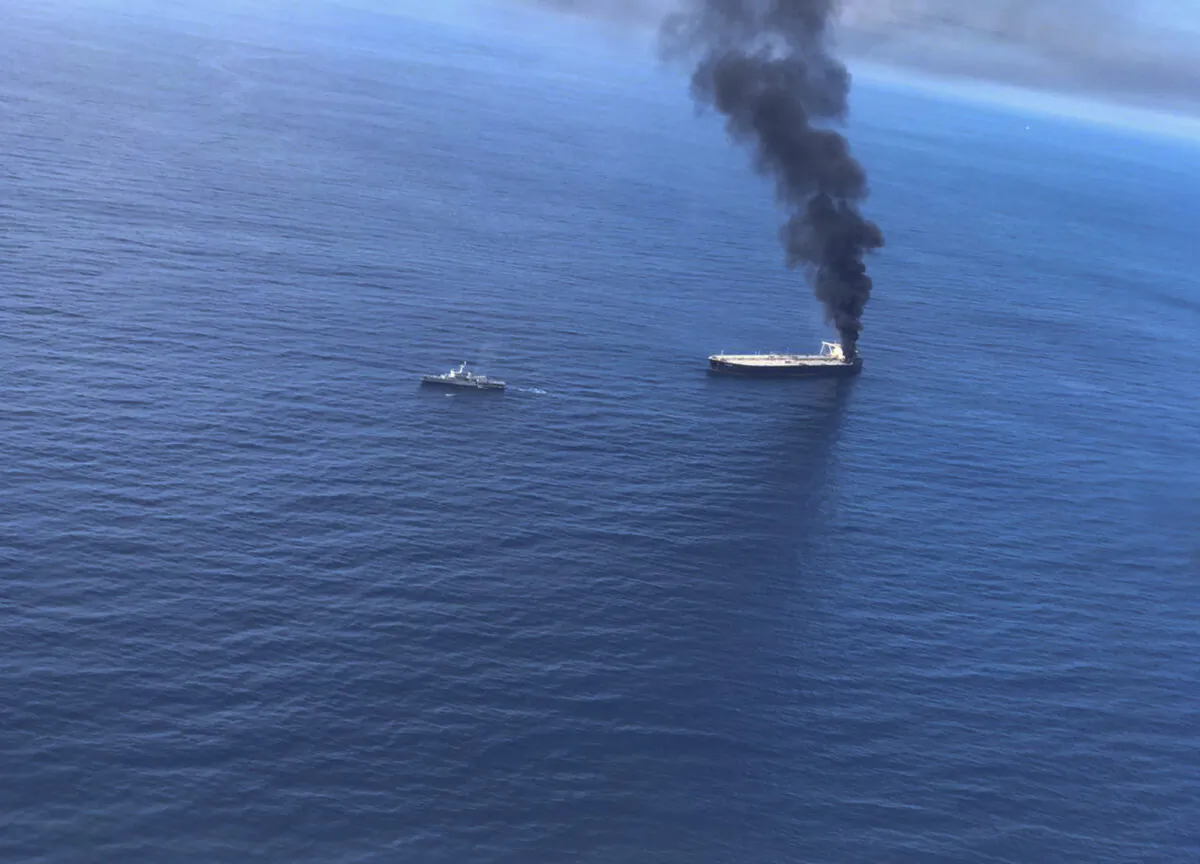 Smoke rising after a fire broke out on a Panama-registered oil tanker about 38 nautical miles (70 kilometers) east of Sri Lanka, on Sept.3, 2020. (Sri Lankan Air Force via AP)