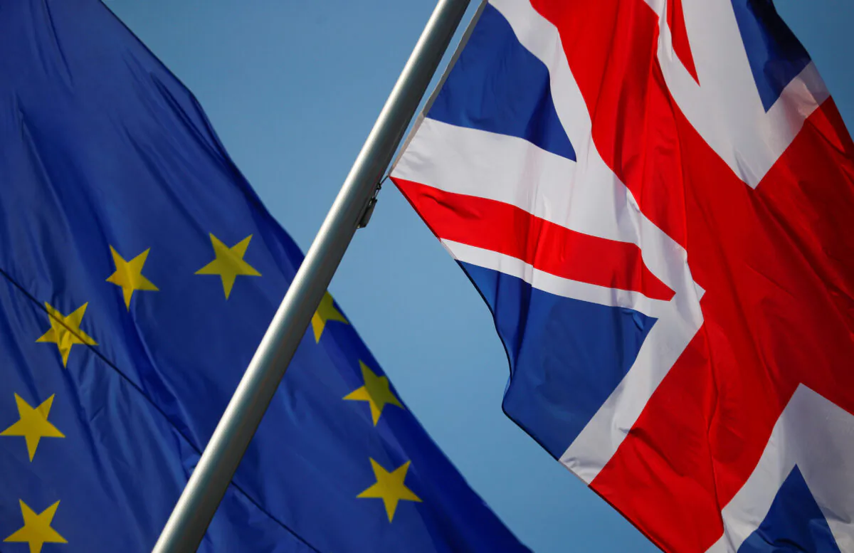 European Union and British flags flutter in front of a chancellery ahead of a visit of British Prime Minister Theresa May in Berlin, Germany, on Apr. 9, 2019. (Hannibal Hanschke/ Reuters)