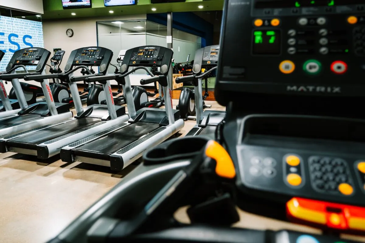 Stock photo of treadmills in an empty gym. (Ryan De Hamer/Unsplash)
