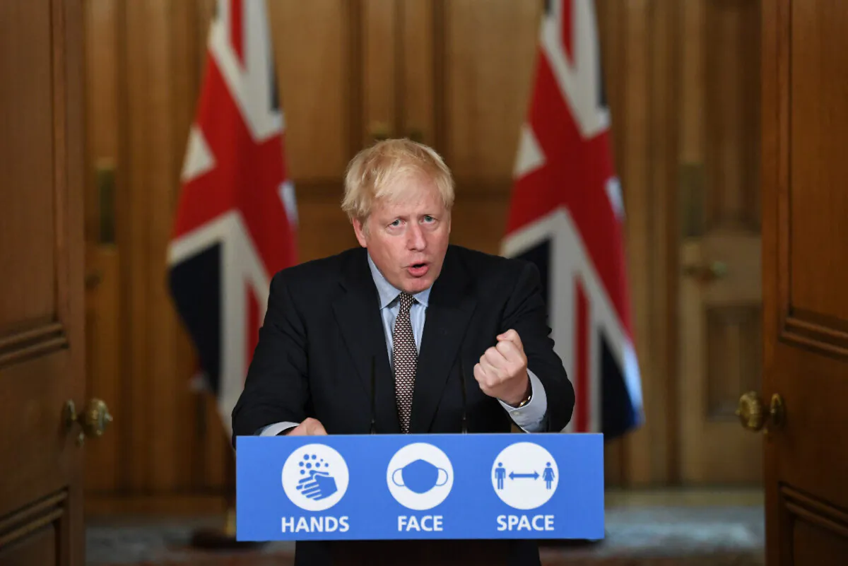 Prime Minister Boris Johnson attends a virtual press conference at Downing Street in London on Sept. 9, 2020. During the press conference he announced that people would no longer be able to meet in groups larger than six from Sept. 14. (Stefan Rousseau-WPA Pool/Getty Images)