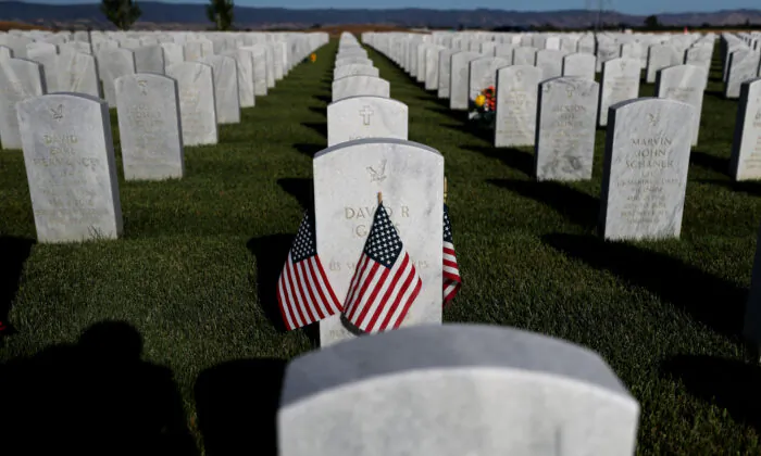 Flags are displayed next to headstones in Dixon, Calif., on May 24, 2020. (Justin Sullivan/Getty Images)