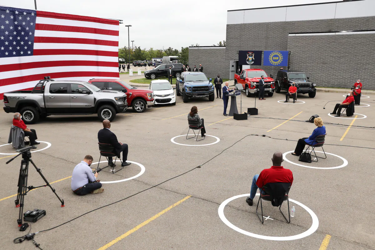 With his audience of union leadership and journalists socially distanced to reduce the risk posed by coronavirus, Democratic presidential nominee and former Vice President Joe Biden delivers remarks in the parking lot outside the United Auto Workers Region 1 offices in Warren, Mich., on Sept. 9, 2020. (Chip Somodevilla/Getty Images)