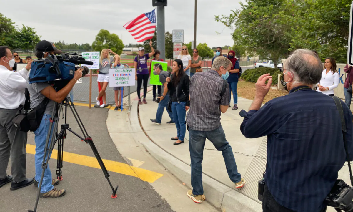 Parents and educators gather to call for the immediate reopening of in-person learning in Orange County schools in Irvine, Calif., on Sept. 8, 2020. (Jack Bradley/The Epoch Times)