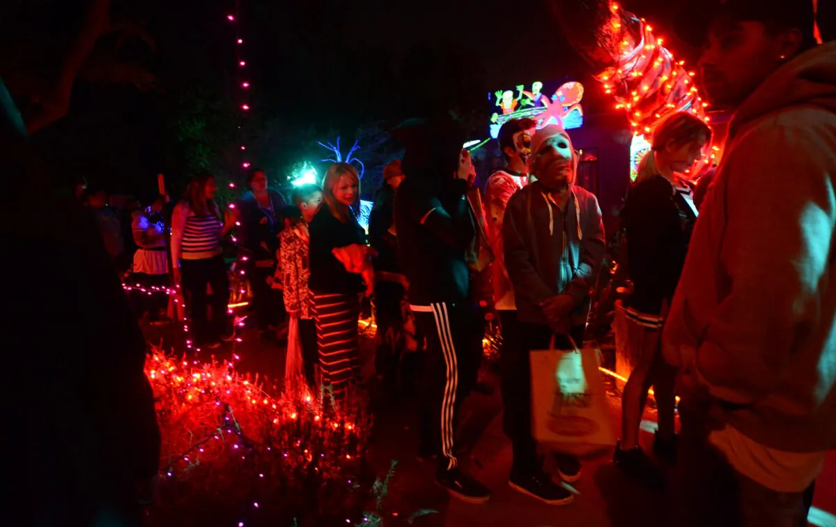 Trick-or-treaters wait in line  in a colorfully decorated neighborhood in Sierra Madre, Calif., in a 2013 file photograph. (Frederic J. Brown/AFP via Getty Images)