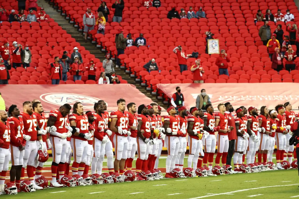 Members of the Kansas City Chiefs stand united with locked arms before the start of a game against the Houston Texans at Arrowhead Stadium in Kansas City, Mo., on Sept. 10, 2020. (Jamie Squire/Getty Images)