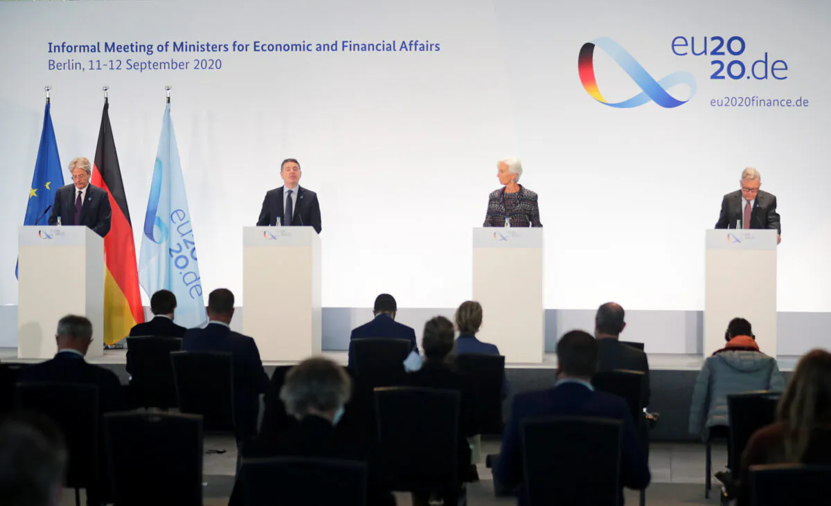 European Economy Commissioner Paolo Gentiloni, Eurogroup President Paschal Donohoe, European Central Bank President Christine Lagarde, and European Stability Mechanism Managing Director Klaus Regling attend a news conference during the Informal Meeting of Ministers for Economics and Financial Affairs in Berlin, on Sept. 11, 2020. (Hannibal Hanschke/Reuters)