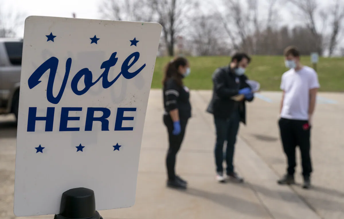 Poll workers are seen during curbside voting in Madison, Wis., on April 7, 2020. (Andy Manis/Getty Images)