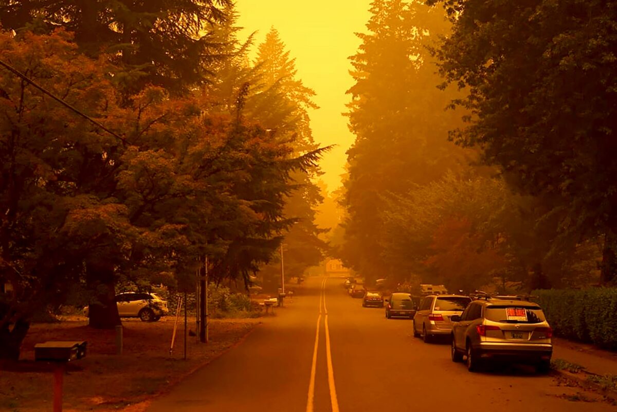 A street is shrouded by smoke from wildfires in West Linn, Ore., Sept. 10, 2020. (Christian Gallagher via AP)