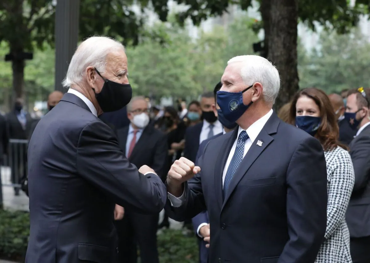 Democratic presidential nominee Joe Biden (L) greets U.S. Vice President Mike Pence as they attend a ceremony at the 9/11 Memorial in New York to commemorate the 19th anniversary of the 9/11 attacks, on Sept. 11, 2020. (Angela Weiss / AFP) 