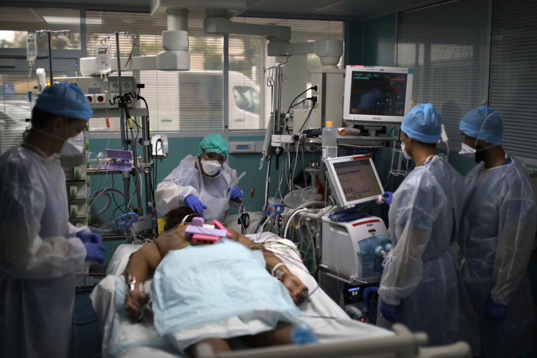 A medical crew works around a patient affected with COVID-19 in a Marseille hospital, France, on Sept.10, 2020. (Daniel Cole/AP)