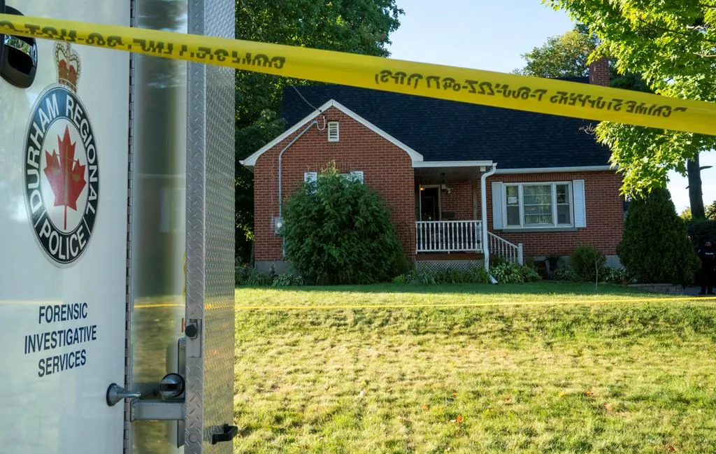 A Durham Police forensics truck sits in front of a home on Parklane Avenue in Oshawa, Ont. on Sept. 4, 2020. Funeral arrangements have been announced for the four family members who were slain in their Oshawa home earlier this month. (The Canadian Press/Frank Gunn)
