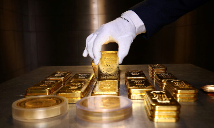 Gold bars and coins are stacked in the safe deposit boxes room of the Pro Aurum gold house in Munich, Germany, on Aug. 14, 2019. (Michael Dalder/Reuters)