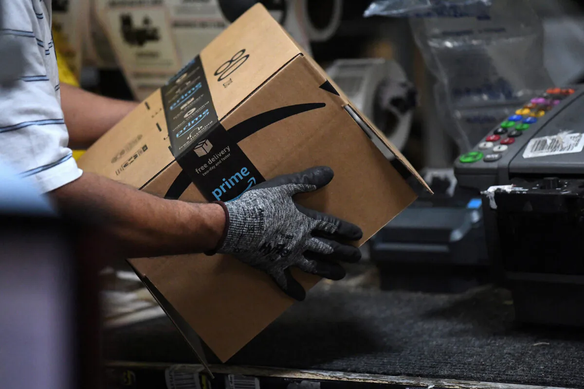 A worker assembles a box for delivery at the Amazon fulfillment center in Baltimore, Maryland, on April 30, 2019. (Clodagh Kilcoyne/File Photo/Reuters)