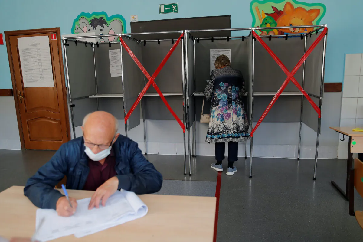 People vote during local elections in the Siberian city of Tomsk, Russia, on Sept. 12, 2020. (Maxim Shemetov/Reuters)