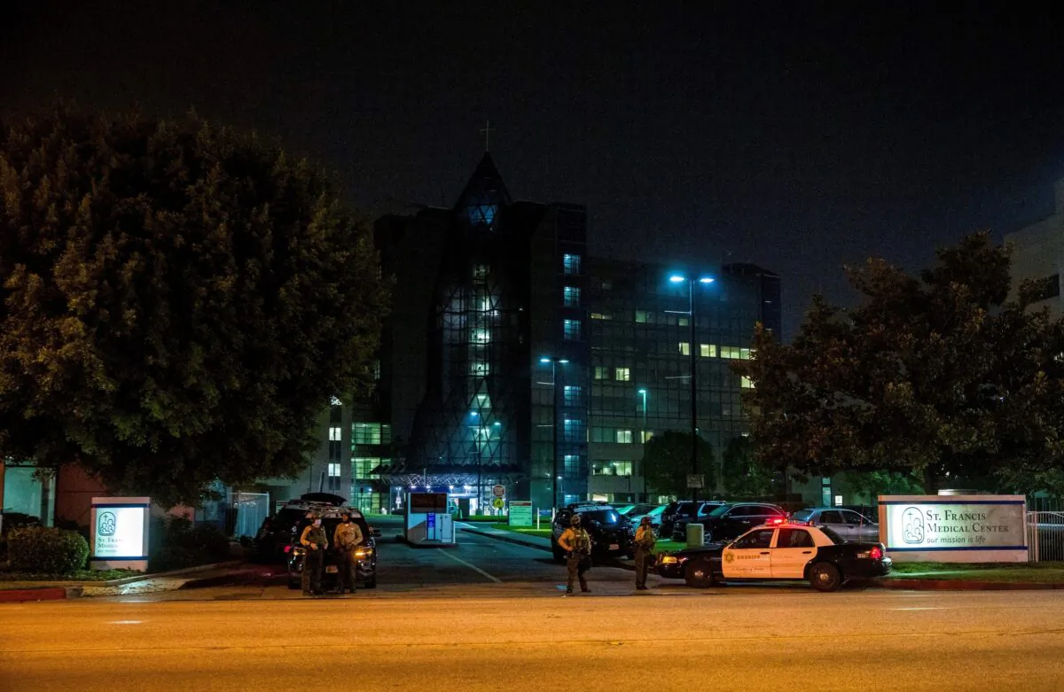 Los Angeles County Sheriff's deputies guard the entrance to St. Francis Medical Center early Sept. 14, 2020, after two deputies were rushed there after being shot in Compton, Calif., on Sept. 12, 2020. (Jintak Han/AP Photo)