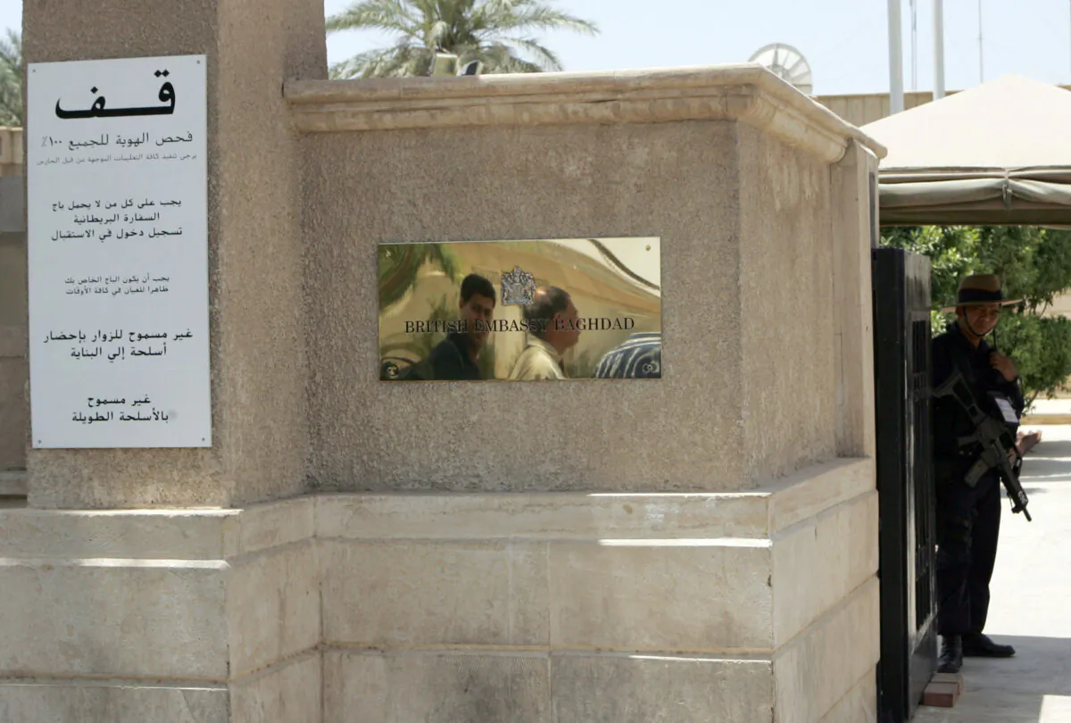 Security personnel guard the entrance of the British Embassy in Baghdad, Iraq, on June 7, 2007. (Khalid Mohammed-Pool/Getty Images)