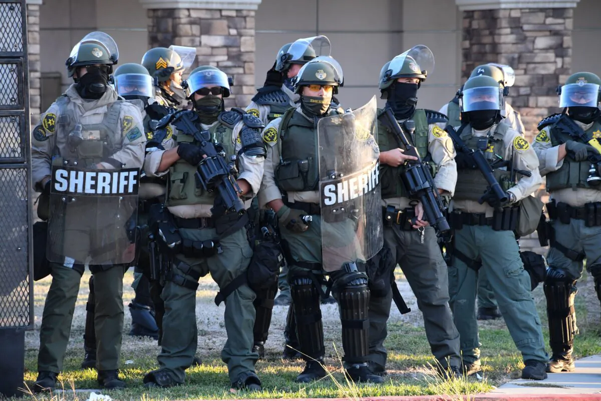 Sheriff's in riot gear stand in front of the South L.A. Sheriff's Station in Los Angeles on Sept. 1, 2020. (Robyn Beck/AFP via Getty Images)