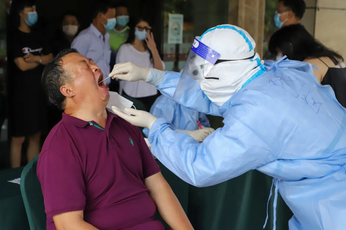 A resident is tested for COVID-19 in Ruili, in southwestern China's Yunnan Province, on Sept. 15, 2020. (STR/AFP via Getty Images)