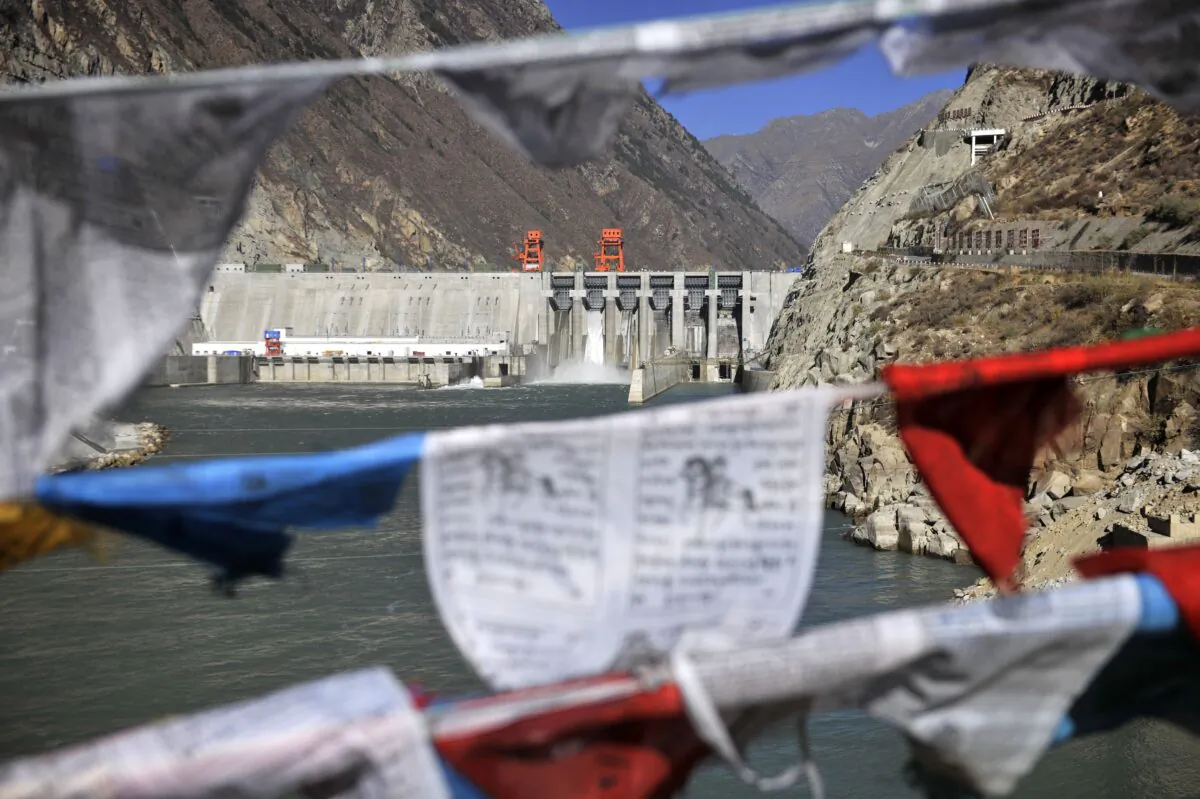 This picture taken on Nov. 23, 2014, shows prayer flags hanging before the Zangmu Hydropower Station in Gyaca county in Lhoka, or Shannan prefecture, southwest China's Tibet region. (
STR/AFP via Getty Images)