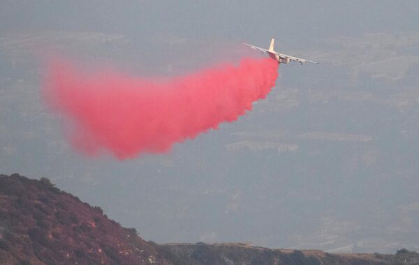 A P2V Neptune air tanker drops fire retardant