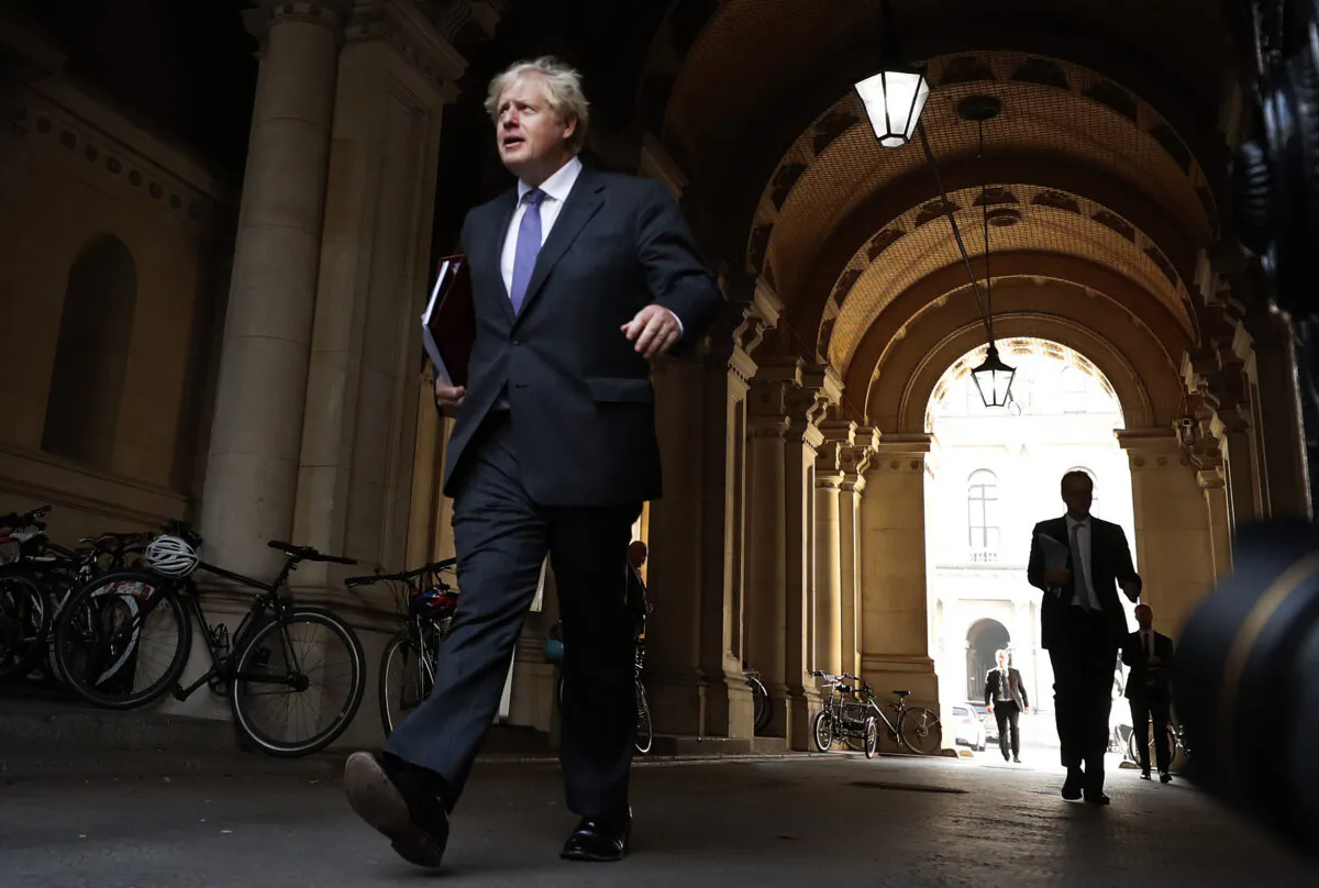 Britain's Prime Minister Boris Johnson walks to his office in Downing Street after a cabinet meeting in London, on Sept. 15, 2020.(Frank Augstein/AP Photo)