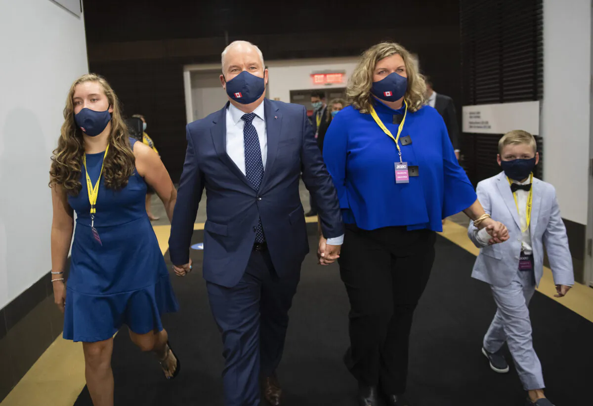 Erin O'Toole walks with his wife Rebecca, second right, daughter Mollie and son Jack, right, after being announced as the new leader of the Conservative Party of Canada, in Ottawa, on Aug. 24, 2020. (Justin Tang/The Canadian Press)