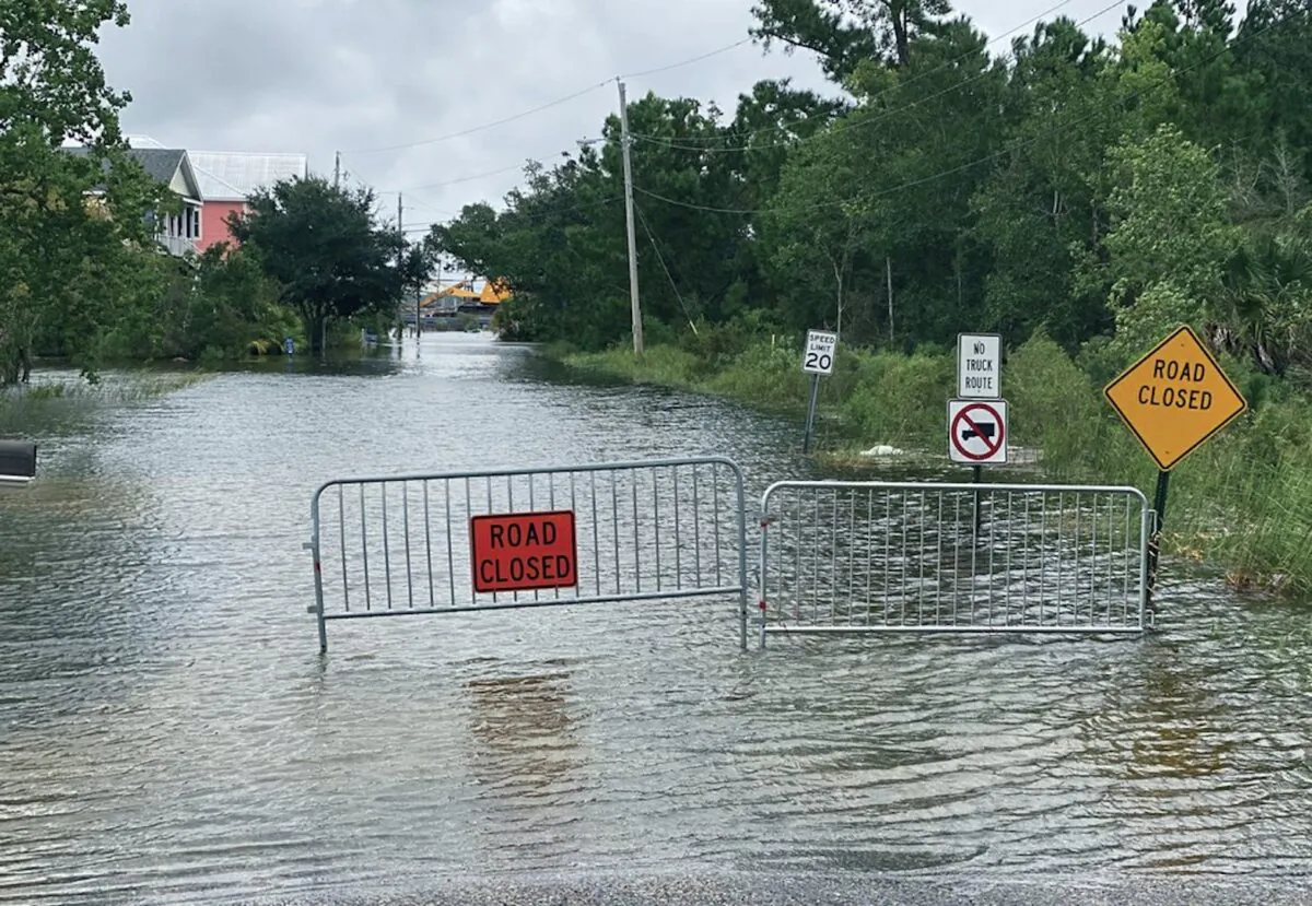 Waters from the Gulf of Mexico, driven by Hurricane Sally, flood this Pass Christian, Miss., street and threaten the homes that line it on Sept. 15, 2020. (Hunter Dawkins/The Gazebo Gazette via AP)