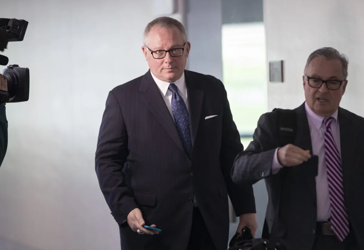 Former Donald Trump campaign official Michael Caputo (L), joined by his attorney Dennis C. Vacco, leaves after being interviewed by Senate Intelligence Committee staff investigating Russian meddling in the 2016 presidential election, on Capitol Hill in Washington on May 1, 2018. (J. Scott Applewhite/AP Photo)
