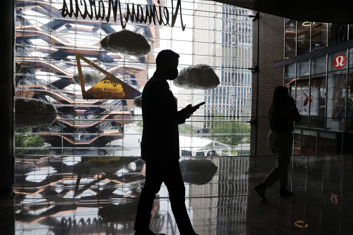 The silhouette of a person holding what seems to be a smartphone is seen in a shopping mall in New York City, on Sept. 09, 2020. (Spencer Platt/Getty Images)