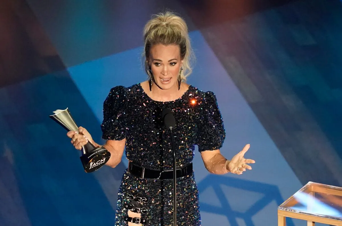 Carrie Underwood accepts the entertainer of the year award in a tie with Thomas Rhett during the 55th annual Academy of Country Music Awards at the Grand Ole Opry House in Nashville, Tenn., on Sept. 16, 2020. (Mark Humphrey/AP Photo)