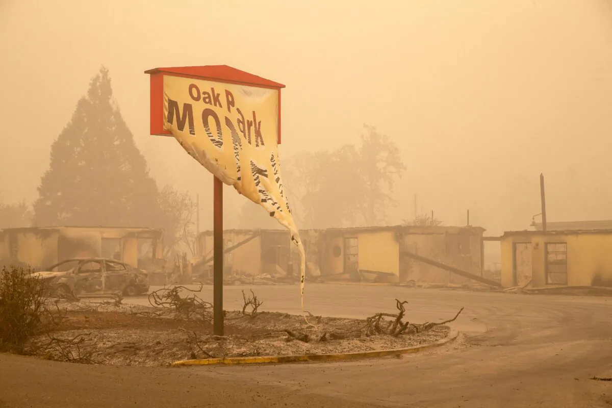 The melted sign of the Oak Park Motel destroyed by the flames of the Beachie Creek Fire is seen in Gates, east of Salem, Oregon on Sept. 13, 2020. (Rob Schumacher/AFP via Getty Images)