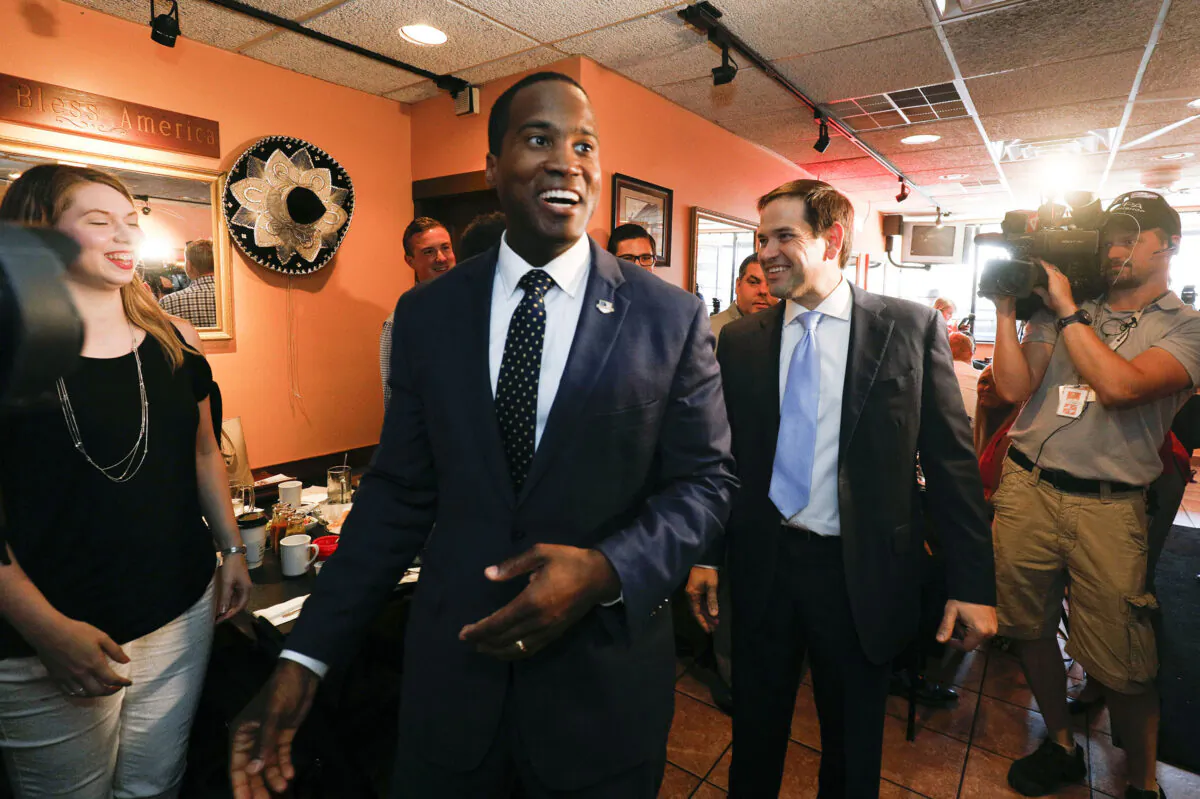 Michigan GOP Senate candidate John James (left) campaigns with the help of Sen. Marco Rubio (R-Fla.) (right) at Senor Lopez Restaurant in Detroit, Mich., on Aug. 13, 2018. (Bill Pugliano/Getty Images)