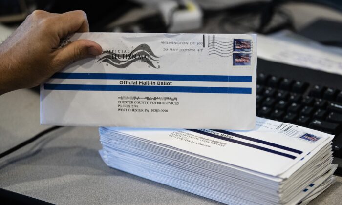 Mail-in primary election ballots are processed at the Chester County Voter Services office in West Chester, Pa., on May 28, 2020. (Matt Rourke/AP Photo)