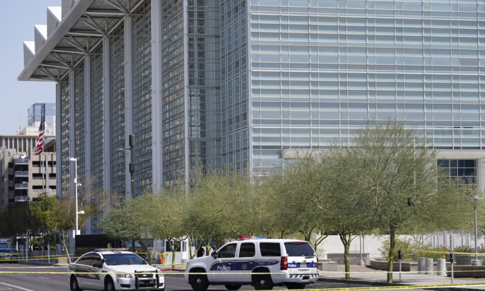 Police cars close off a street outside the Sandra Day O'Connor U.S. Courthouse in Phoenix, Ariz., on Sept. 15, 2020. (Ross D. Franklin/AP Photo)