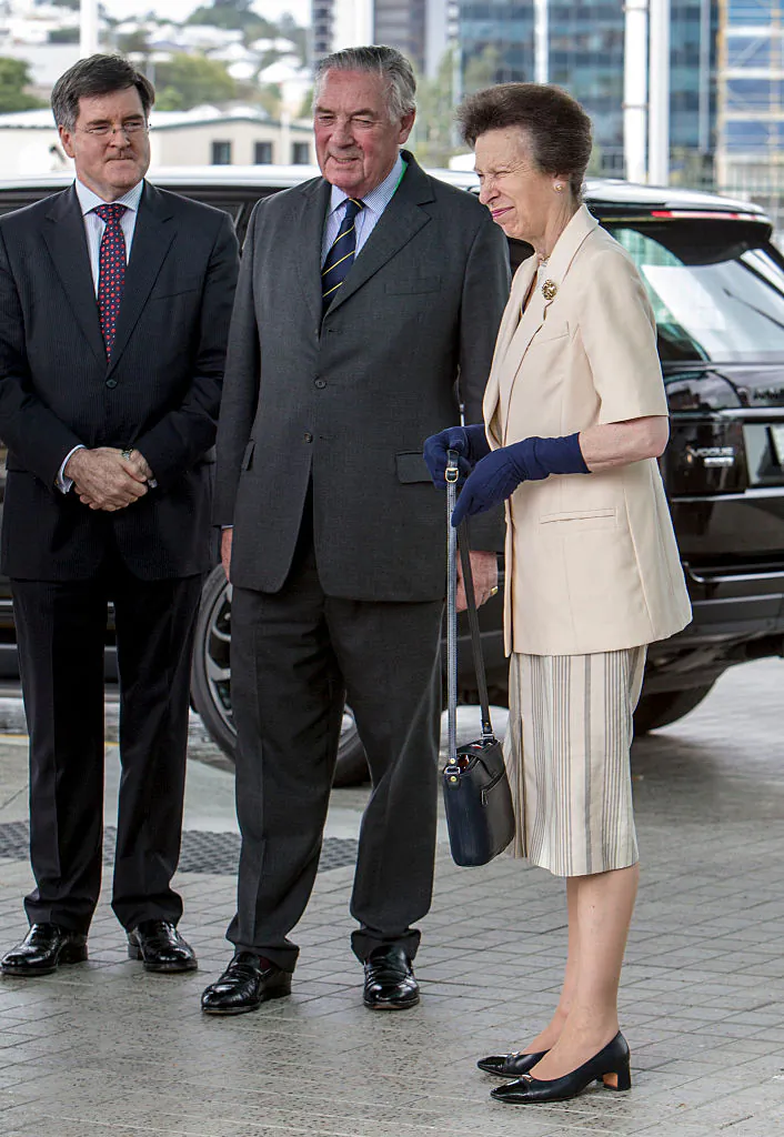 Princess Anne, Princess Royal is greeted by Lord Samuel Vestey (C) and John McVeigh MP (L) as she arrives at the Agricultural Conference at the Royal International Convention Centre on October 21, 2014 in Brisbane, Australia.  (Photo by Glenn Hunt/Getty Images)