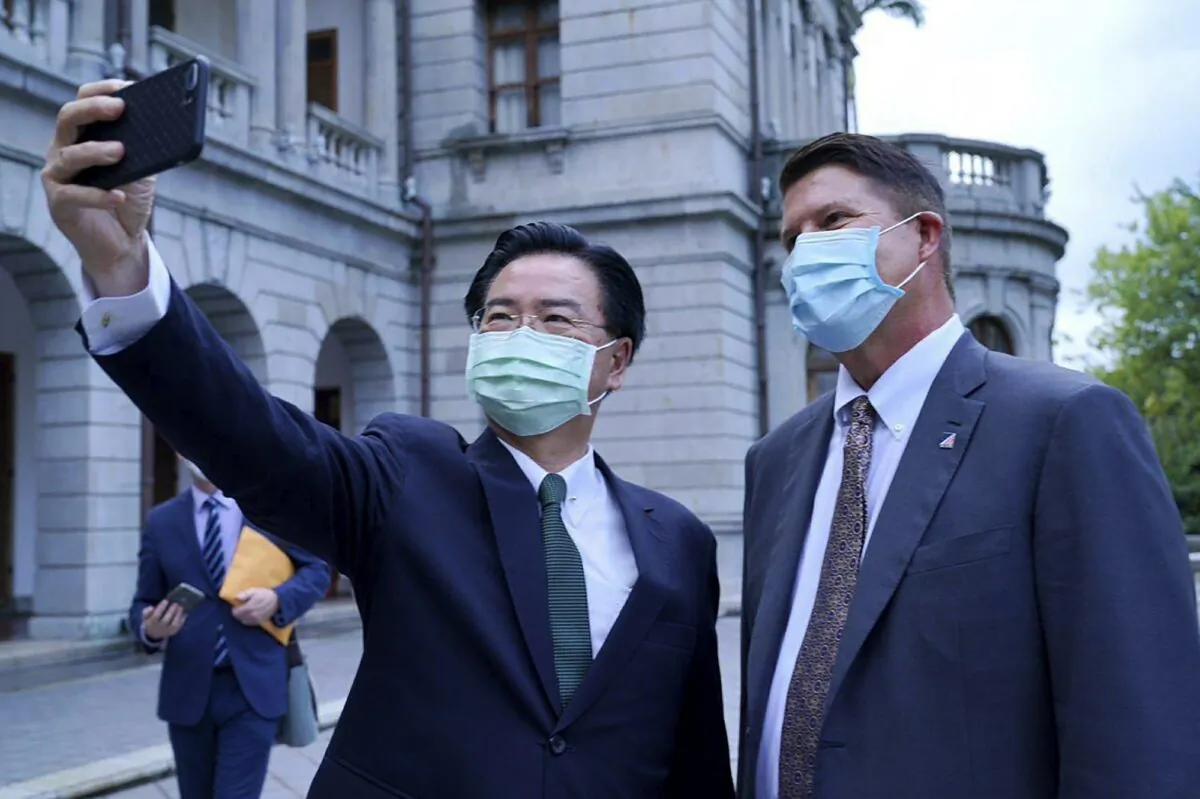 Taiwan's Foreign Minister Joseph Wu pose for a selfie with U.S. Under Secretary of State Keith Krach (R) during a meeting in Taipei, Taiwan, on Sept. 18, 2020. (Taiwan Ministry of Foreign Affairs via AP)