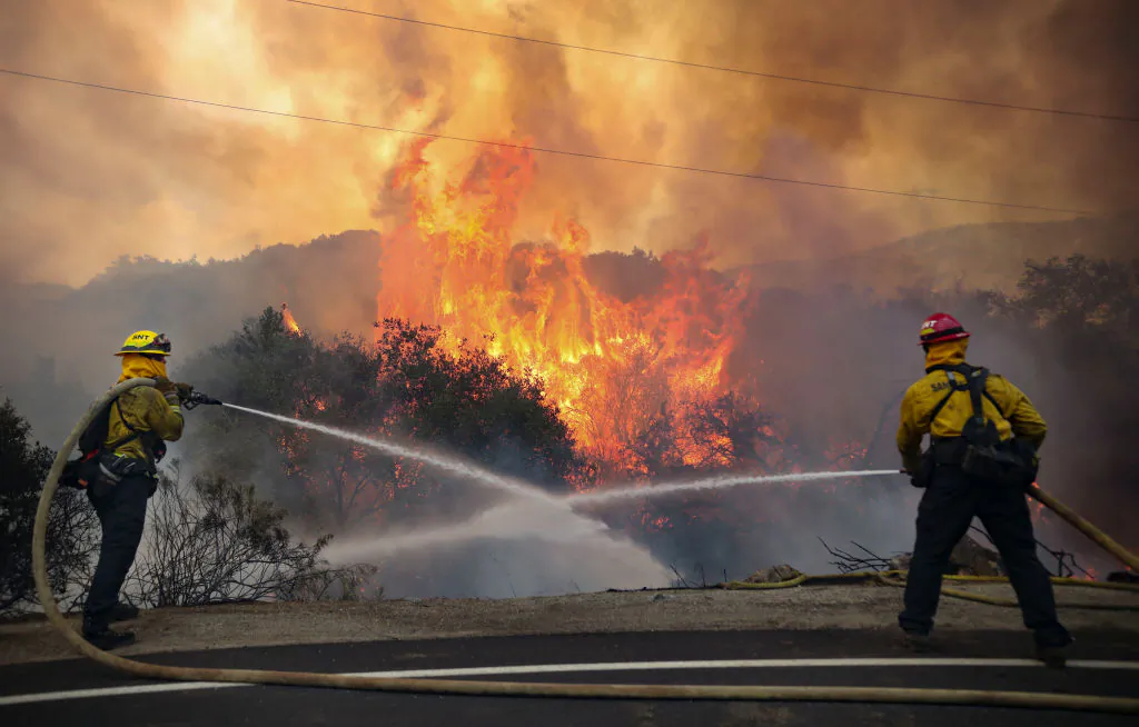 San Miguel County Firefighters battle a brush fire along Japatul Road during the Valley Fire in Jamul, Calif., on Sept. 6, 2020. (Sandy Huffaker/AFP via Getty Images)