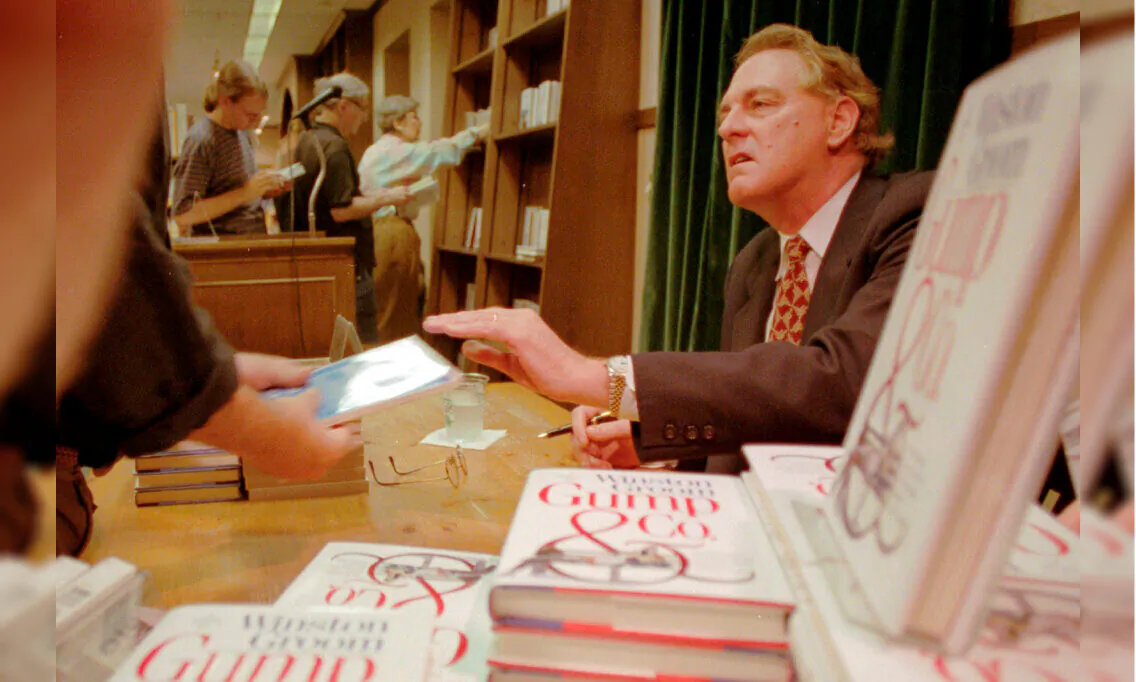 Winston Groom, author of "Forrest Gump," the book on which the film was based, signs copies of "Gump & Co.," the sequel to "Forrest Gump," at a bookstore in New York City, N.Y., on Aug. 21, 1995. (Anders Krusberg/AP Photo)