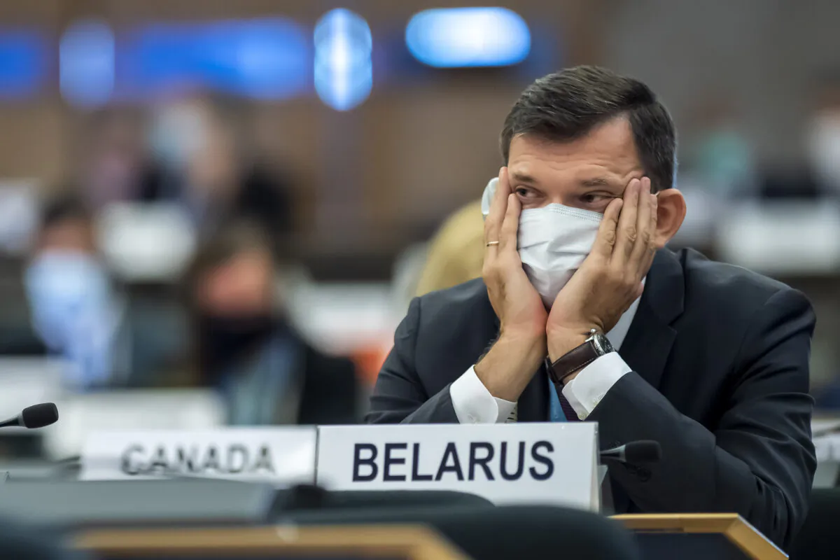 Yury Ambrazevich, head of Belarus' delegation and Permanent Representative to the UN Office, listen to the speeches, during the opening of 45th session of the Human Rights Council, at the European headquarters of the United Nations in Geneva, Switzerland, on Sept. 14, 2020. (Martial Trezzini/Keystone via AP Photo)