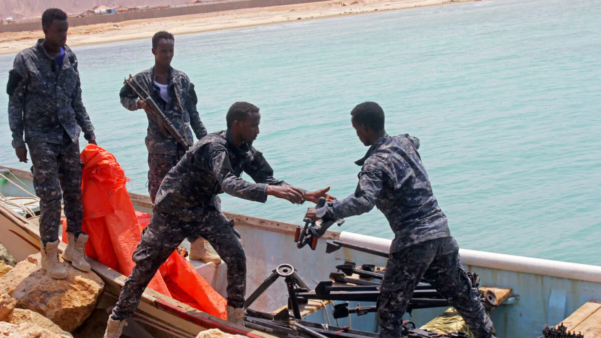 Somali Puntland forces receive weapons seized in a boat on the shores of the Gulf of Aden in the city of Bosasso, Puntland region, Somalia Sept. 23, 2017. (Abdiqani Hassan/Reuters)