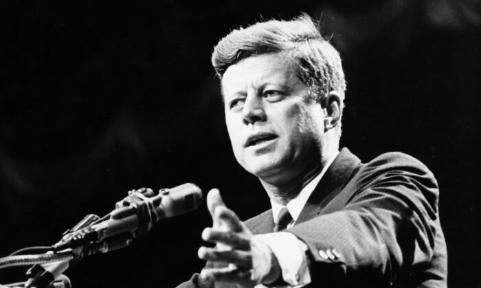 President John F. Kennedy urged citizens to find the right answers,, rather than partisan, to America’s problems. (Central Press/Getty Images)