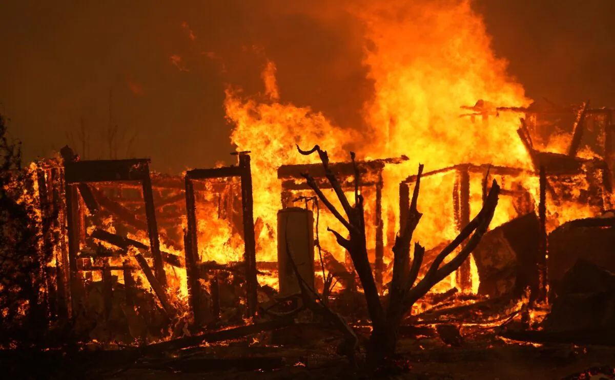 A home burns along Cima Mesa Rd. as the Bobcat Fire advances in Juniper Hills, Calif., on Sept. 18, 2020. (Marcio Jose Sanchez/AP Photo)