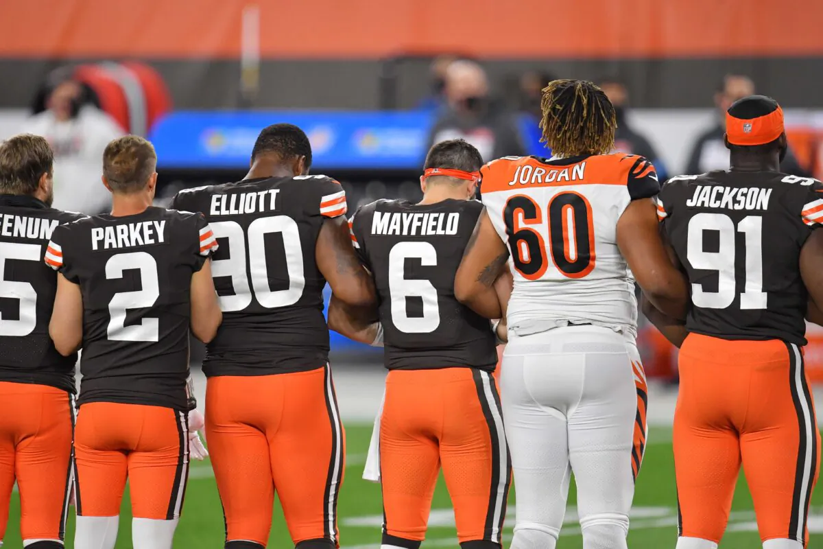Players lock arms before the start of a game between the Cleveland Browns and the Cincinnati Bengals at FirstEnergy Stadium on September 17, 2020 in Cleveland, Ohio. (Jason Miller/Getty Images)