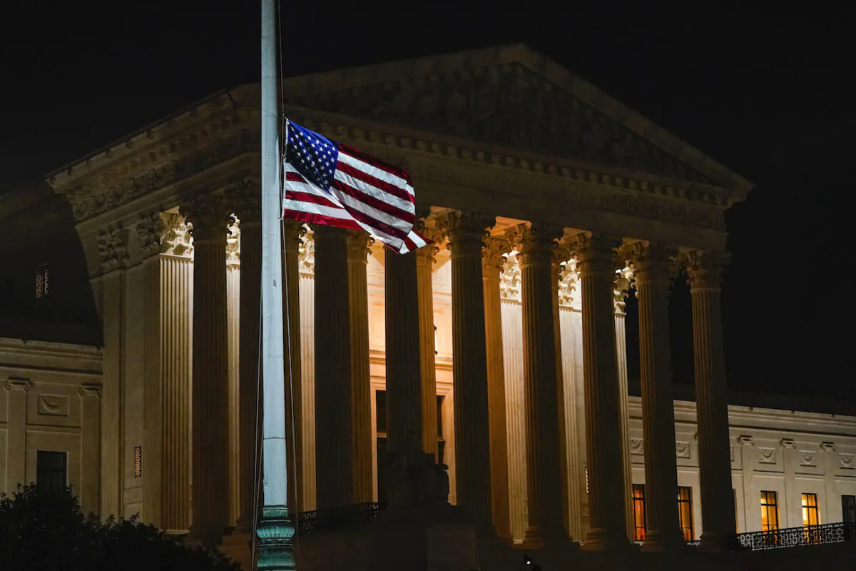 The American flag blows in the wind outside the Supreme Court building on Sept. 18, 2020. (Alex Brandon/AP Photo)