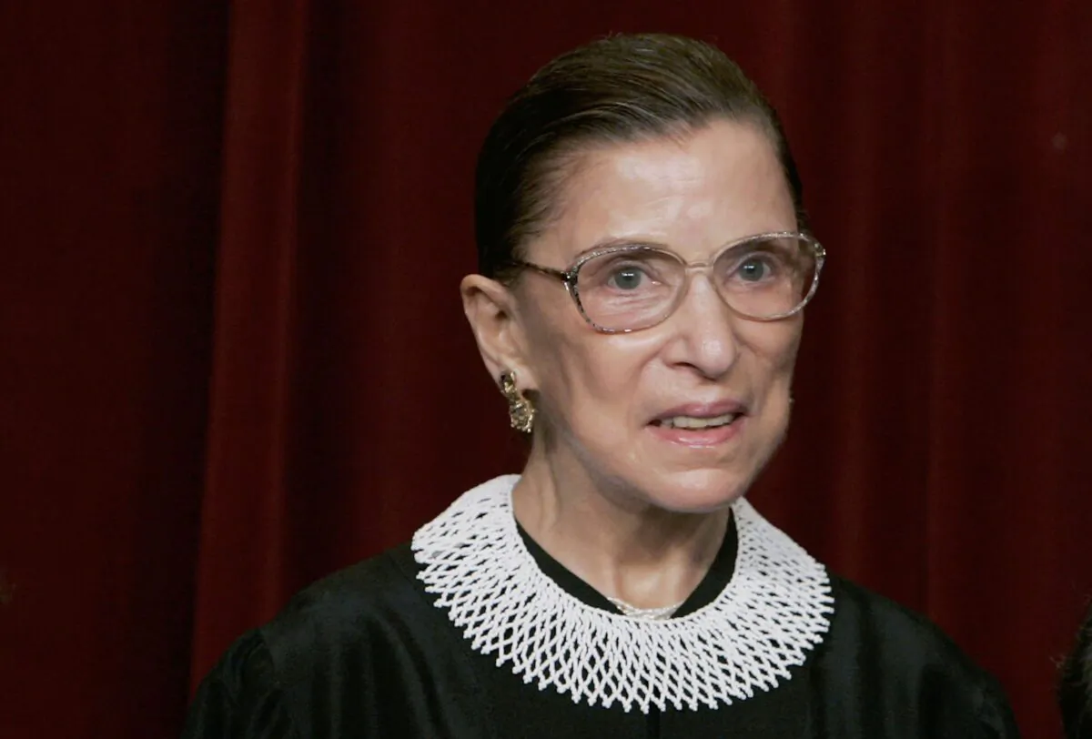 Supreme Court Justice Ruth Bader Ginsburg smiles during a photo session with photographers at the U.S. Supreme Court in Washington on March 3, 2006. (Mark Wilson/Getty Images)