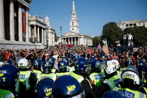 People gather in Trafalgar Square to protest against the lockdown imposed by the government, in London