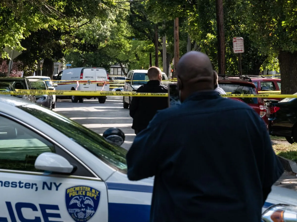 Police officers investigate a crime scene after a shooting at a backyard party in Rochester, N.Y., on Sept. 19, 2020. (Joshua Rashaad McFadden/Getty Images)
