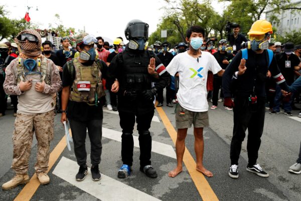 Pro-democracy protesters link arms during a mass rally