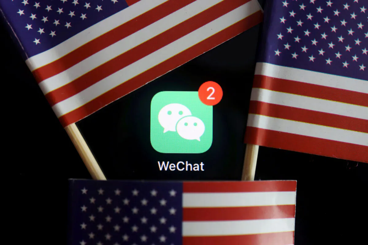 The messenger app WeChat is seen among U.S. flags in this illustration picture taken on Aug. 7, 2020. (Florence Lo/Reuters)